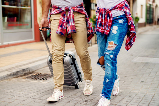 active young couple with shirts tied around waists