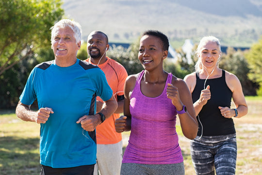 healthy seniors jogging and smiling