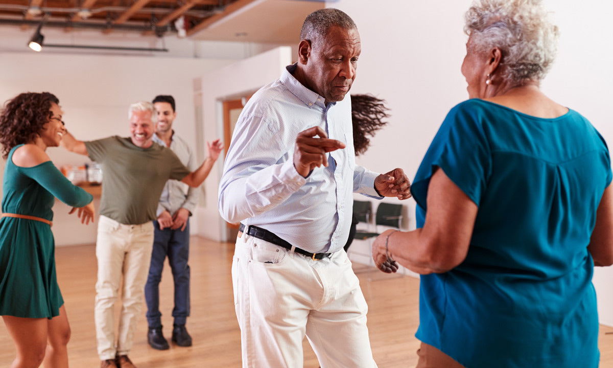 senior couple taking dance class 