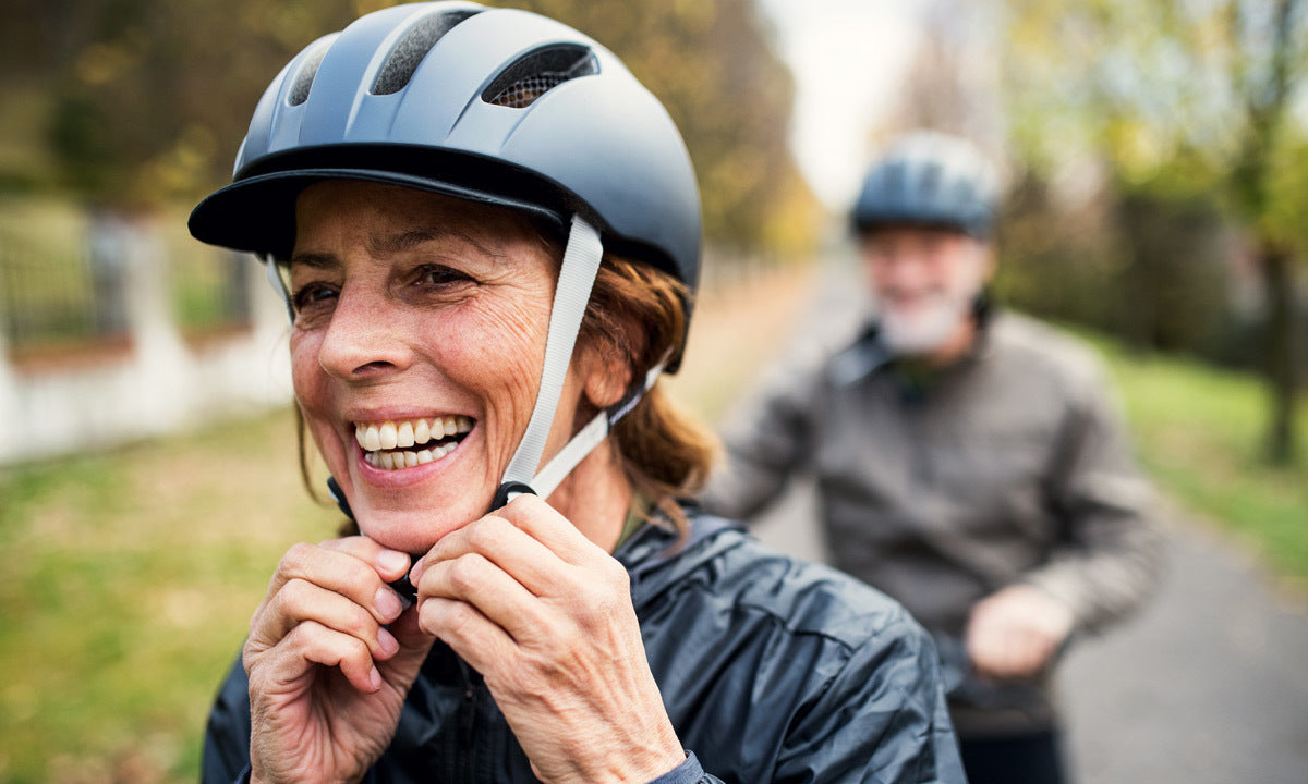 smiling woman securing bike